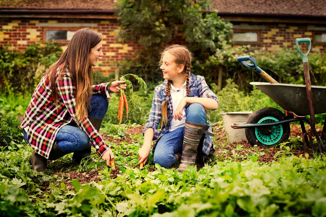 Mother and Daughter Enjoying Bonding Time Gardening Together | Family Life Tips Magazine